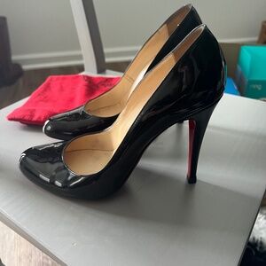 Louboutin red bottom back heels